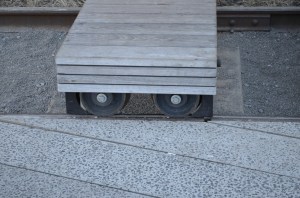The lounge chairs rested on old rail wheels on the old track