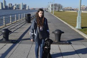 Blind Beader and her guide dog, Jenny at a pier in New York